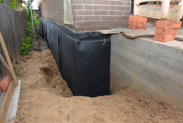 Happy homeowners after waterproofing job in Magnolia Springs